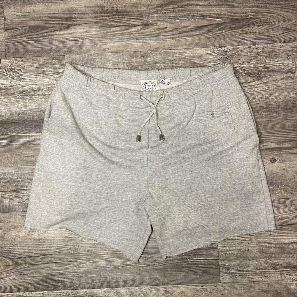 Carolina Blues sweat shorts featuring a drawstring waist and a raw-edge hem